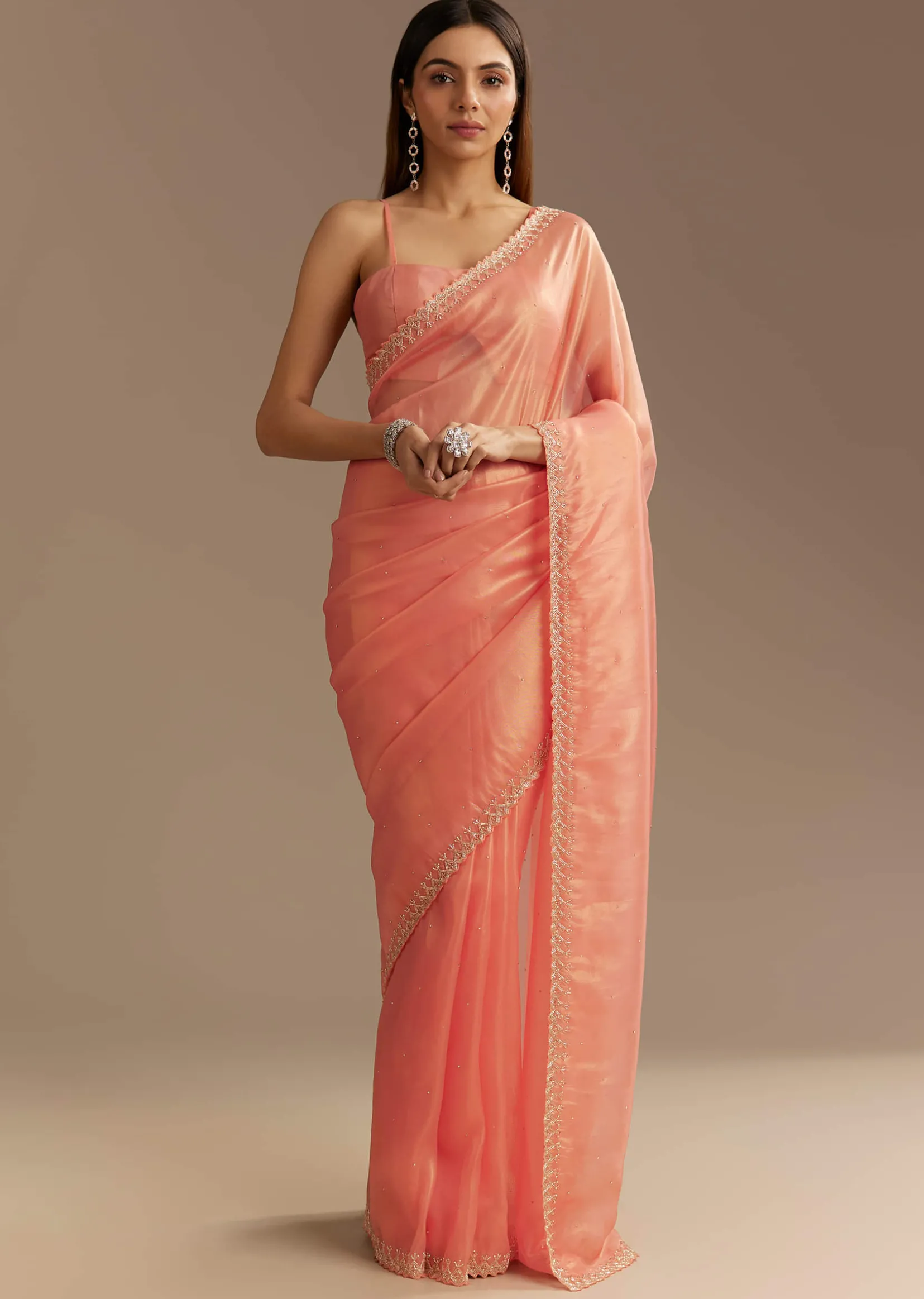 Peach Tissue Saree With Stones Cutdana Embellishments And Scallop Border