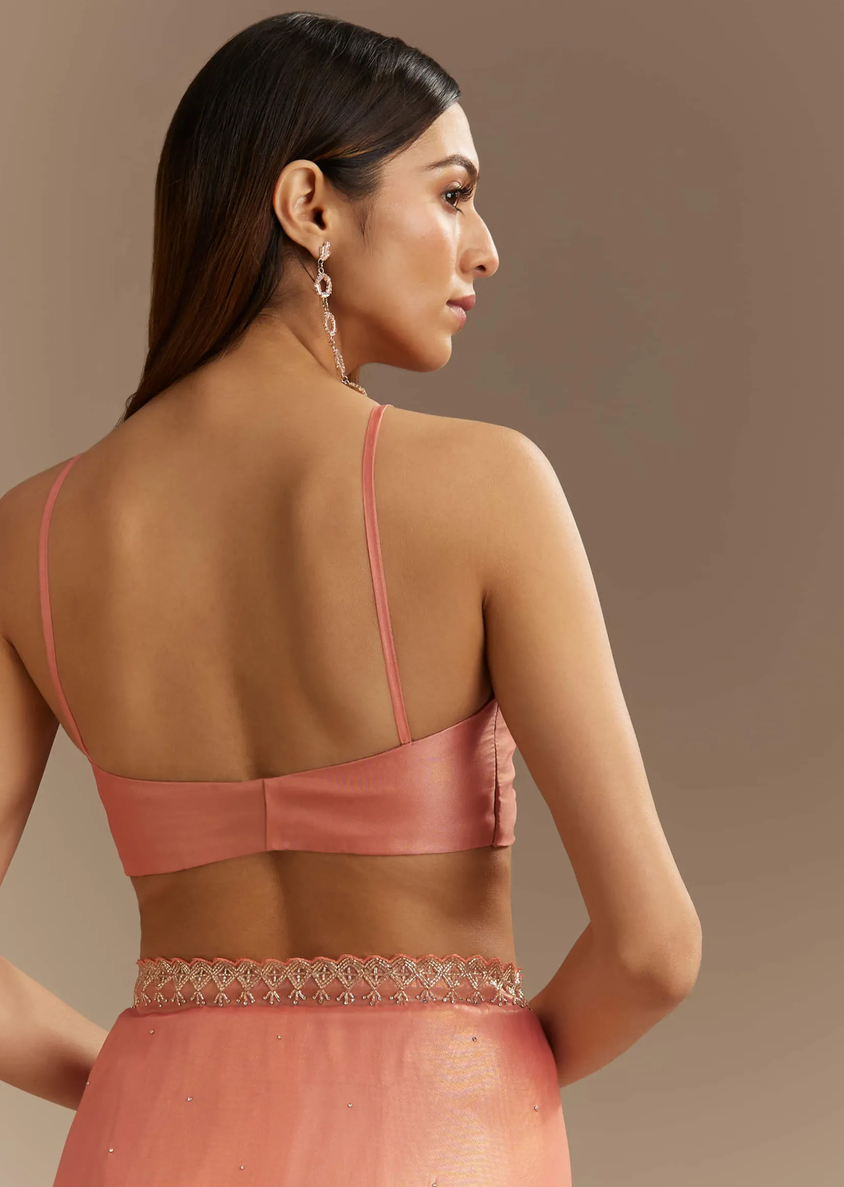 Peach Tissue Saree With Stones Cutdana Embellishments And Scallop Border