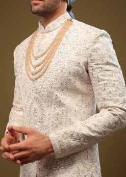 Pearl White Silk Sherwani Set With Exquisite Zari And Sequin Embroidery