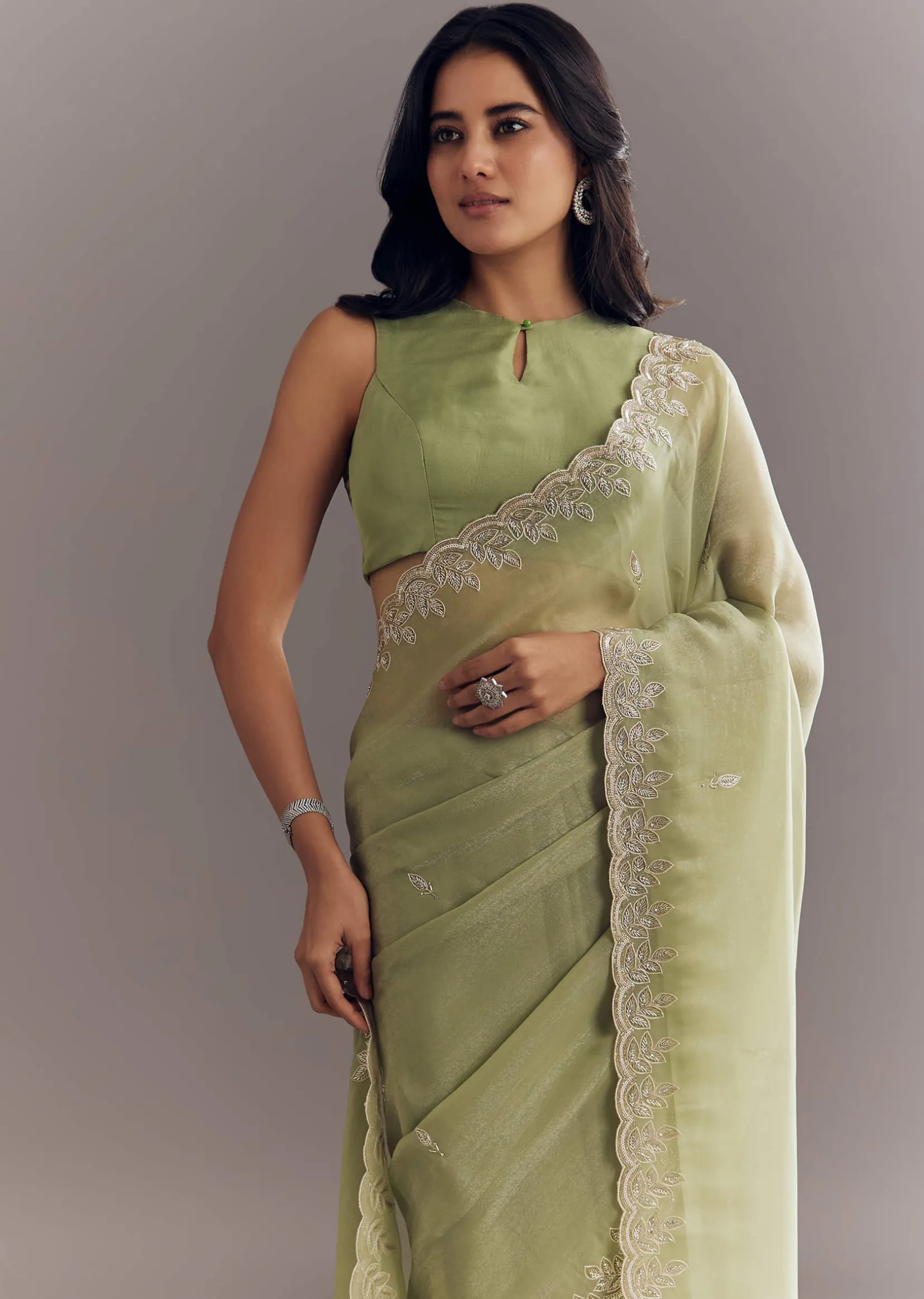 Pista Green Tissue Saree With Leaf Motif Embroidery In Sequins And Cutdana
