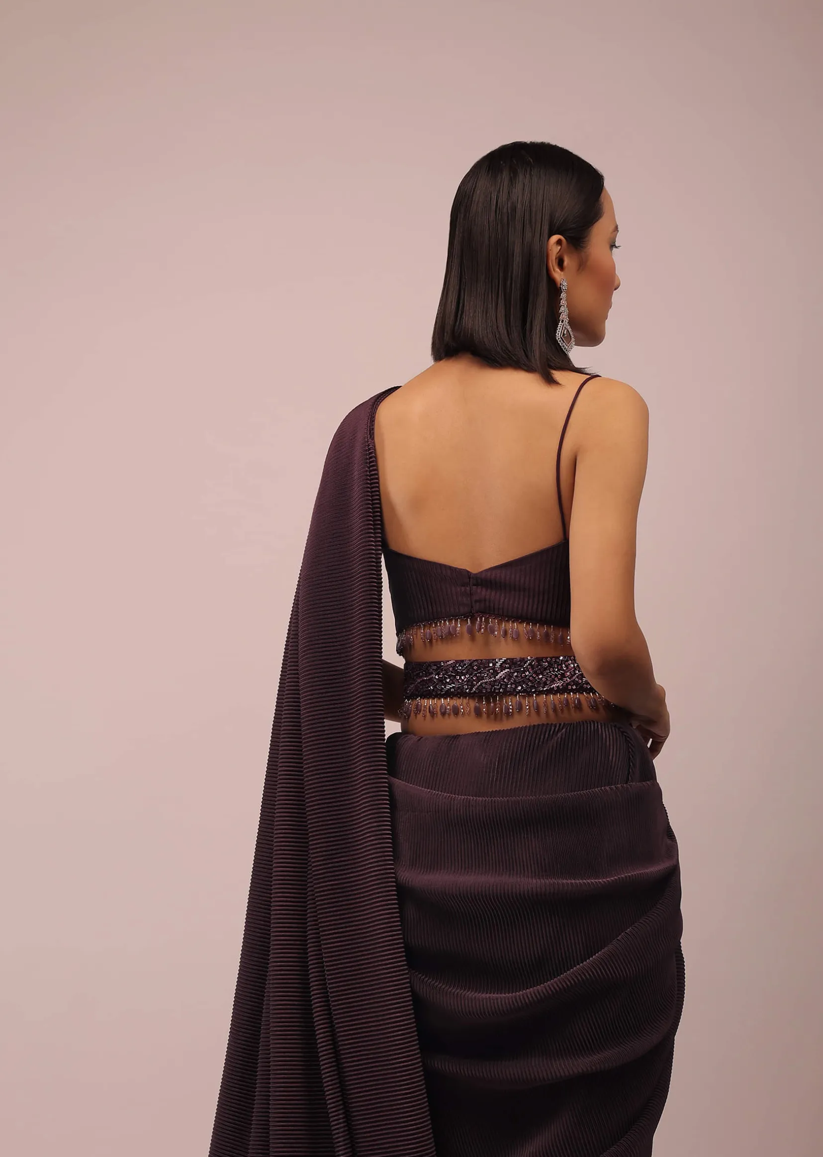 Plum Saree With Moti And Cut Dana Fringes Detailing On The Pallu And A Spaghetti Straps Crop Top With An Embroidered Belt In Fringes