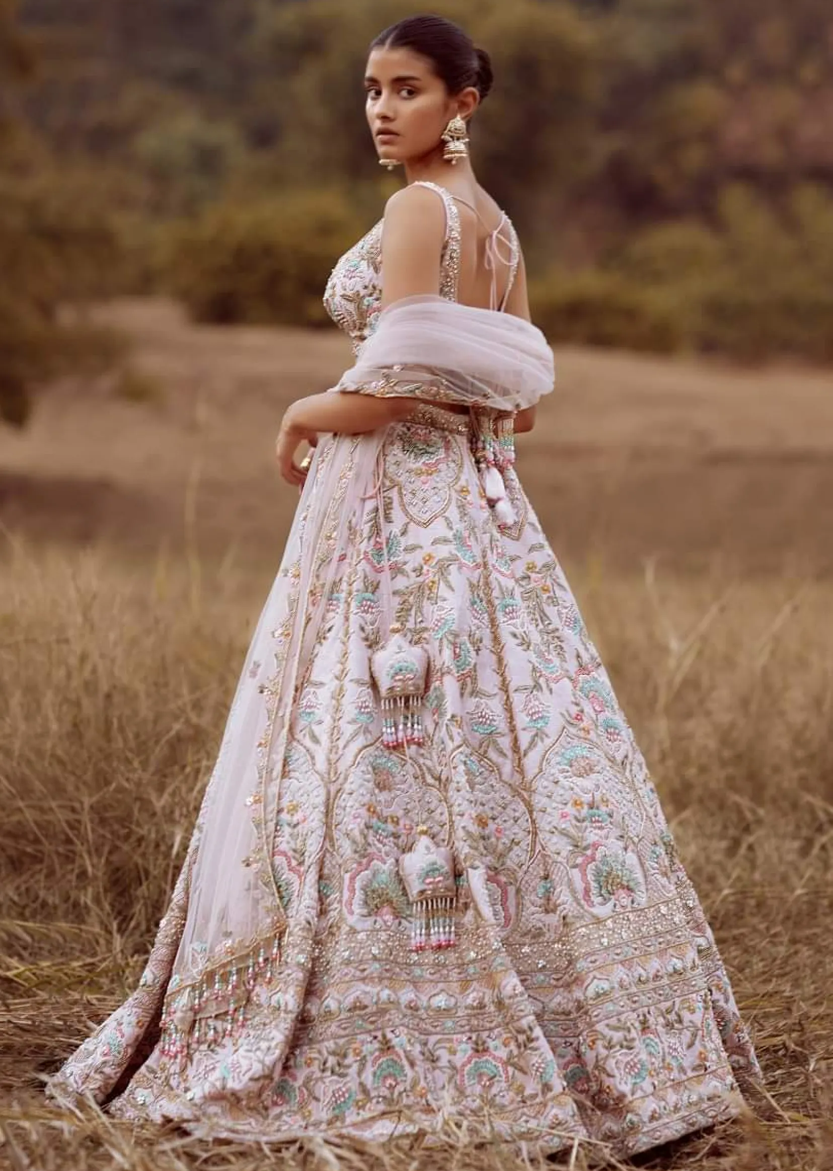 Powder Pink Lehenga Choli In Raw Silk With Colorful Resham And Cut Dana Embroidered Summertime Flowers And Mughal Motifs