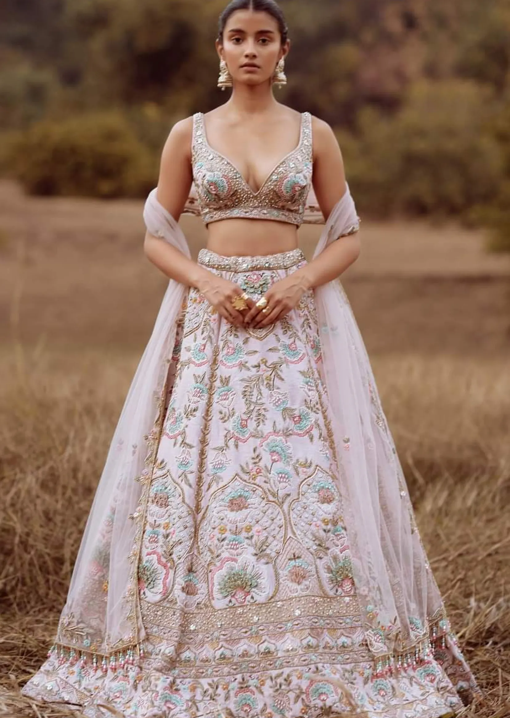 Powder Pink Lehenga Choli In Raw Silk With Colorful Resham And Cut Dana Embroidered Summertime Flowers And Mughal Motifs