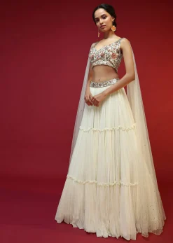 Powder White Lehenga Choli With Attached Cape And Hand Embroidery Using Colorful Resham And Sequins In Floral Motifs