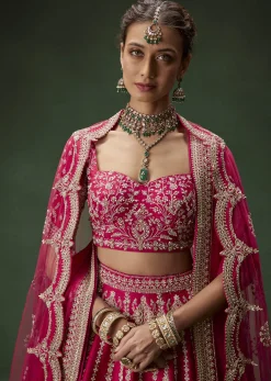 Rani Pink Bridal Lehenga With Embroidered Blouse And Heavily Worked Dupattas
