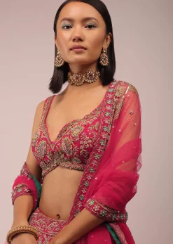 Rani Pink Lehenga In Golden Zari Work Embroidery Inspired By Mughal Architecture With Matching Net Dupatta In Embroidered Buttis