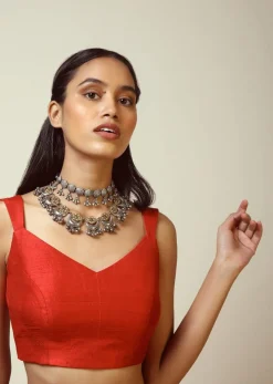 Red Sleeveless Blouse In Raw Silk With V Cut Neckline And Side Zip Closure