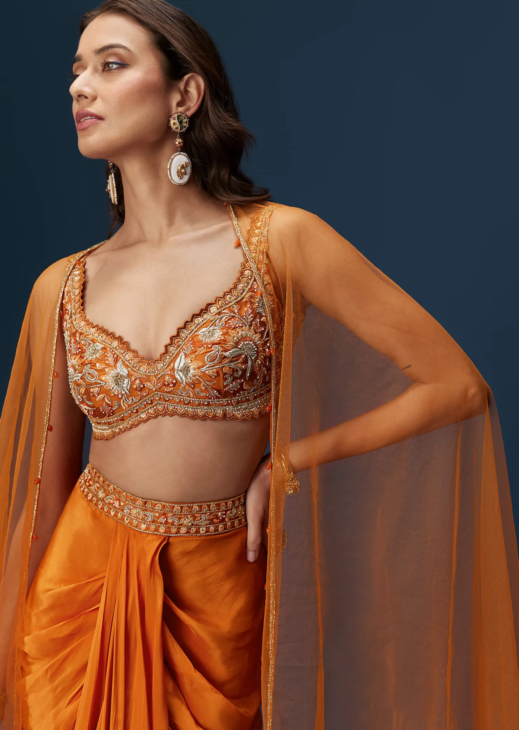Rust Dhoti Skirt Set With Embellished Blouse And Tassel Net Dupatta
