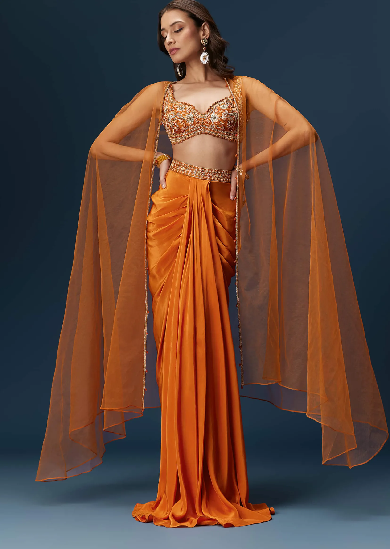 Rust Dhoti Skirt Set With Embellished Blouse And Tassel Net Dupatta