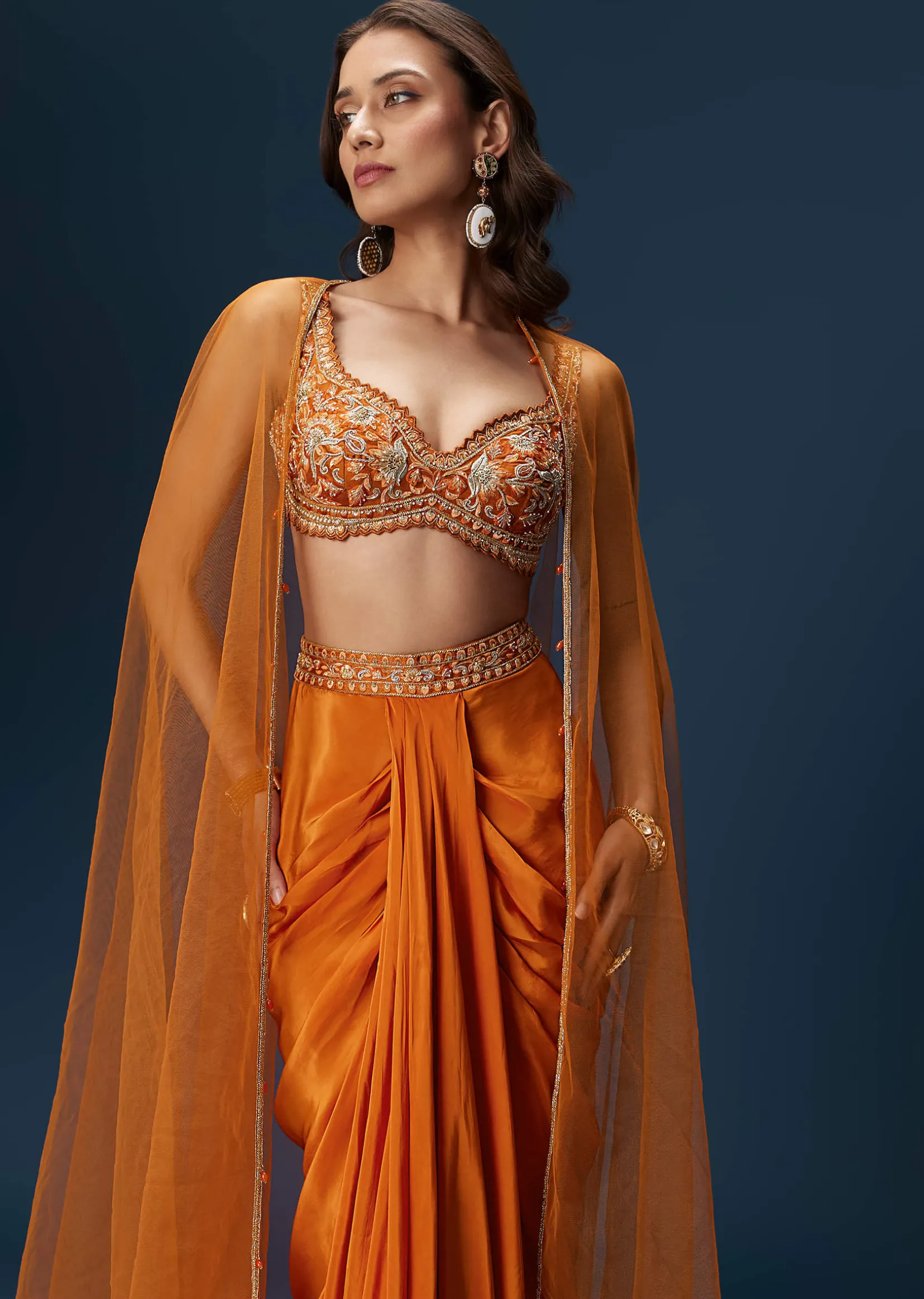 Rust Dhoti Skirt Set With Embellished Blouse And Tassel Net Dupatta