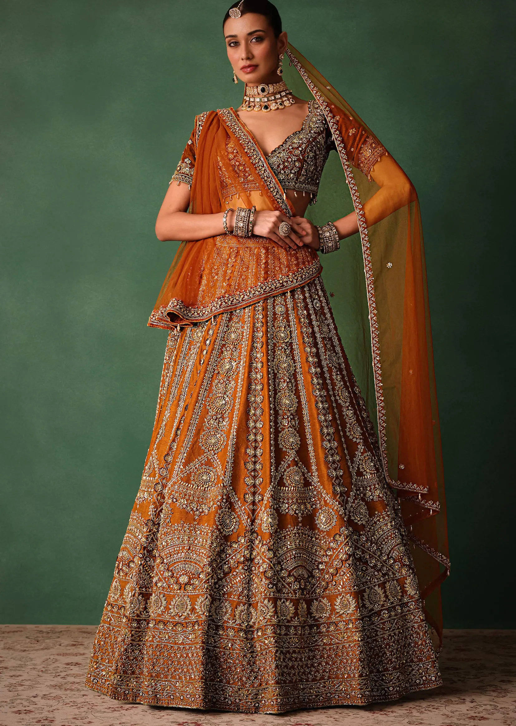 Rust Embroidered Bridal Lehenga With Deep Neckline Blouse And Dupatta