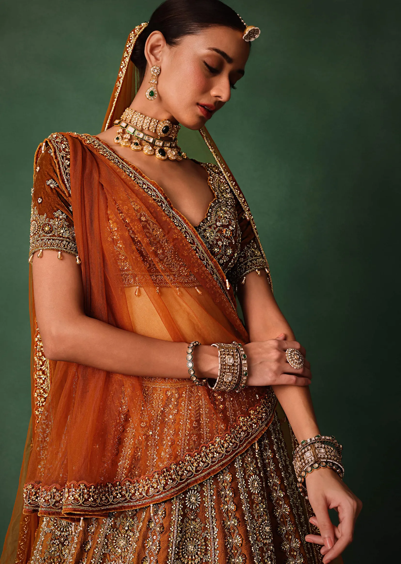 Rust Embroidered Bridal Lehenga With Deep Neckline Blouse And Dupatta