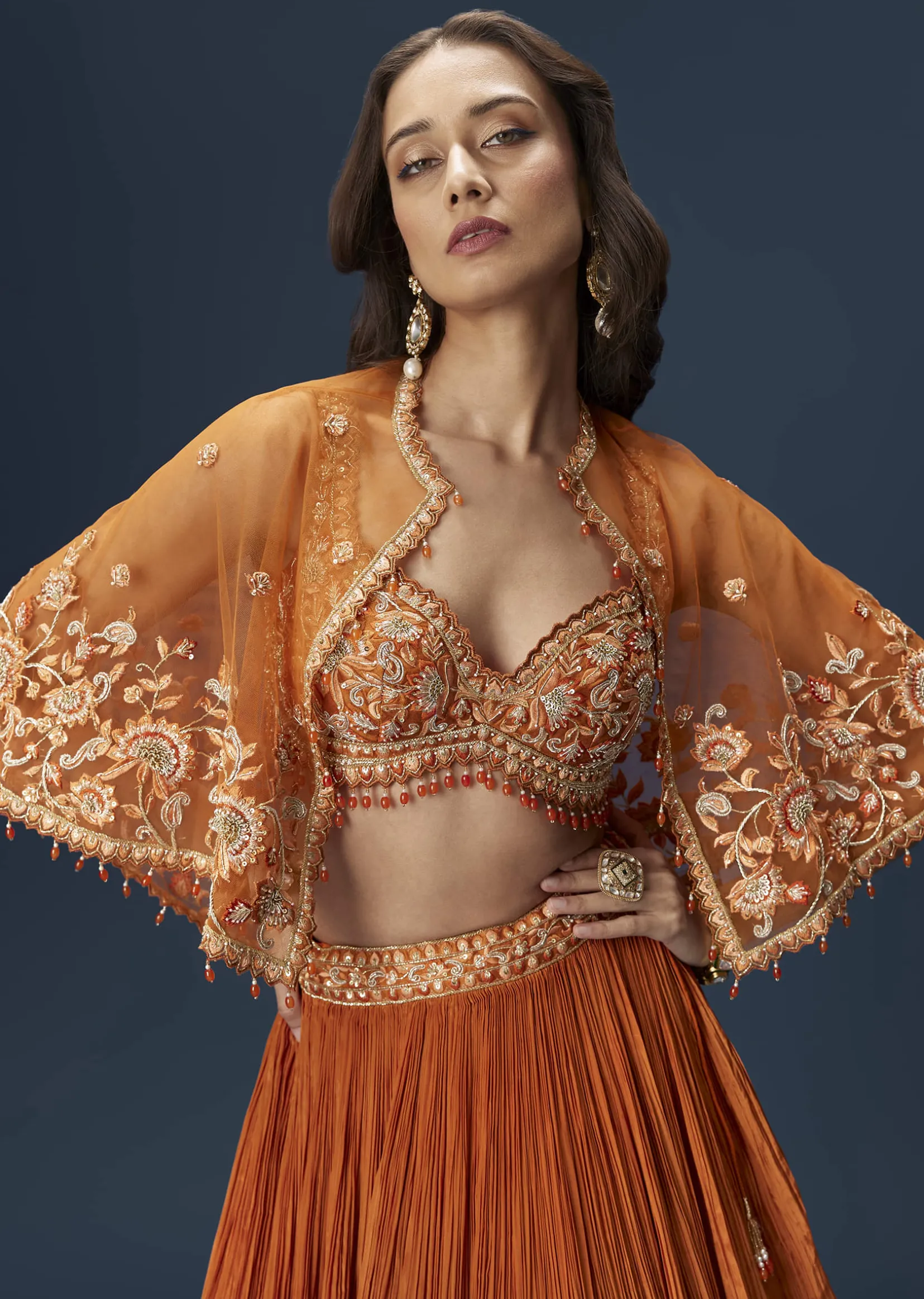 Rust Orange Embroidered Lehenga With Dramatic Cape And Blouse