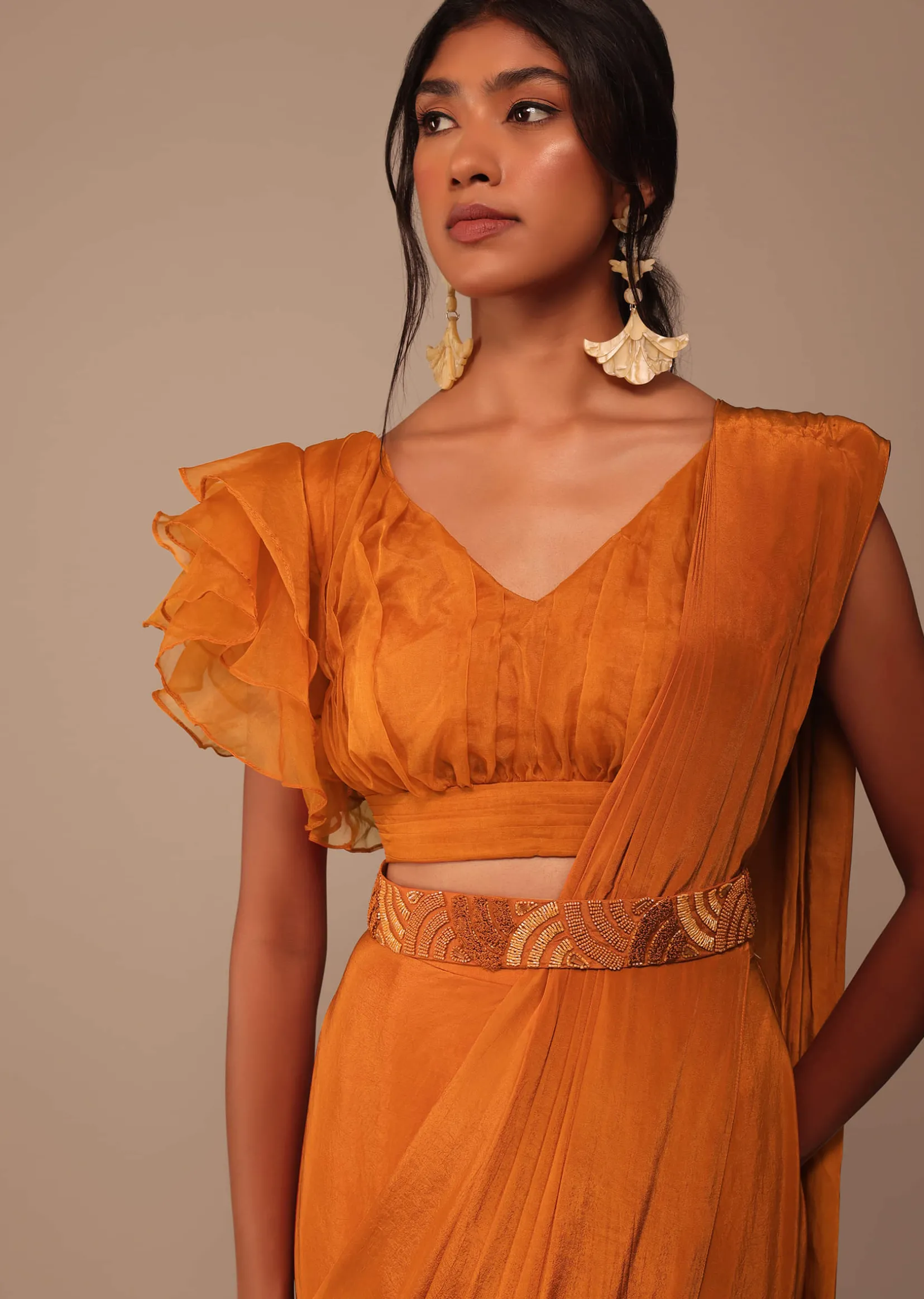 Rust Orange Pre Drape Saree With Fancy Ruffle Blouse And Embroidered Belt