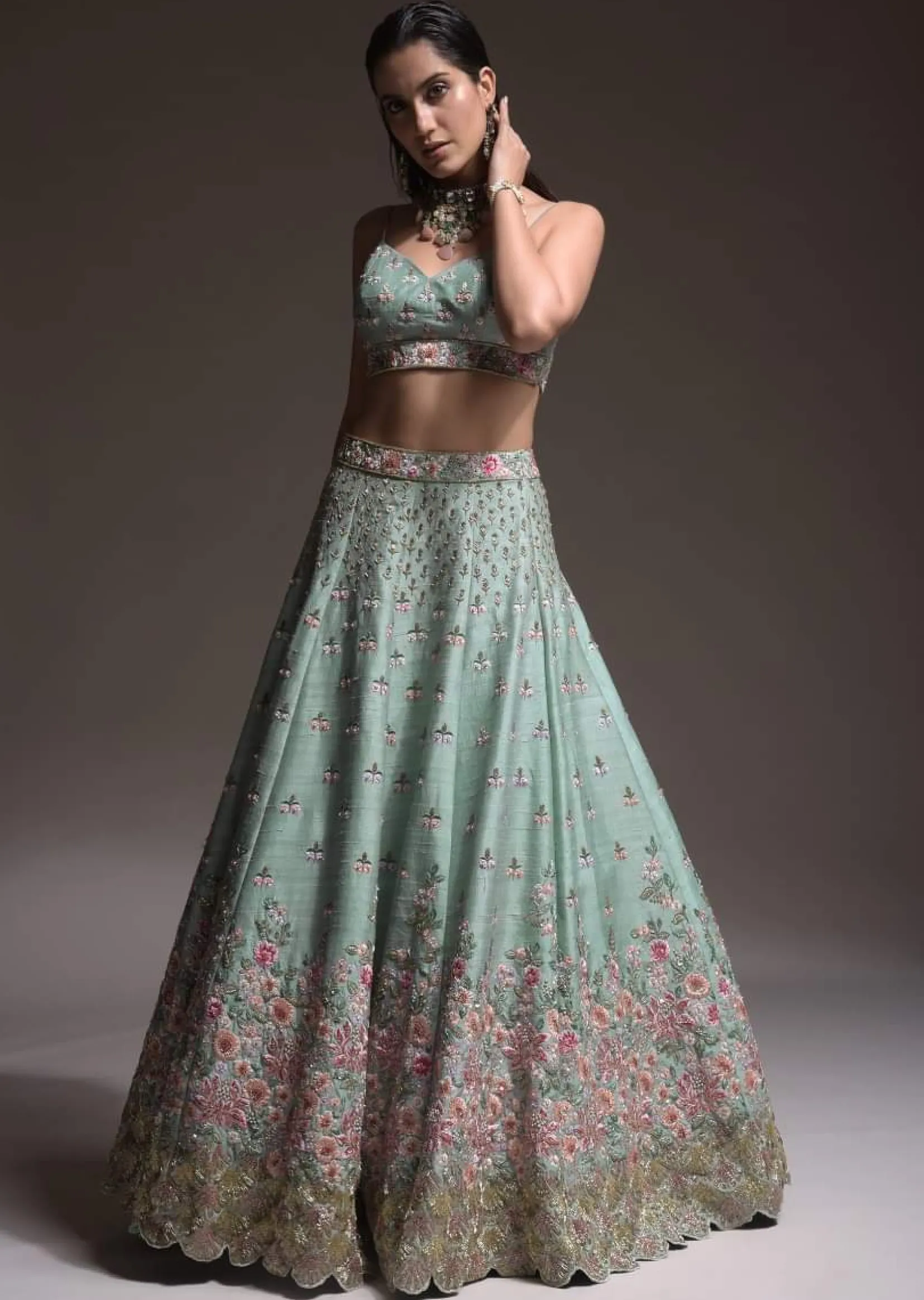 Sage Green Lehenga Choli In Raw Silk With Vibrant Resham Embroidered Cluster Of Summer Blooms And Buttis