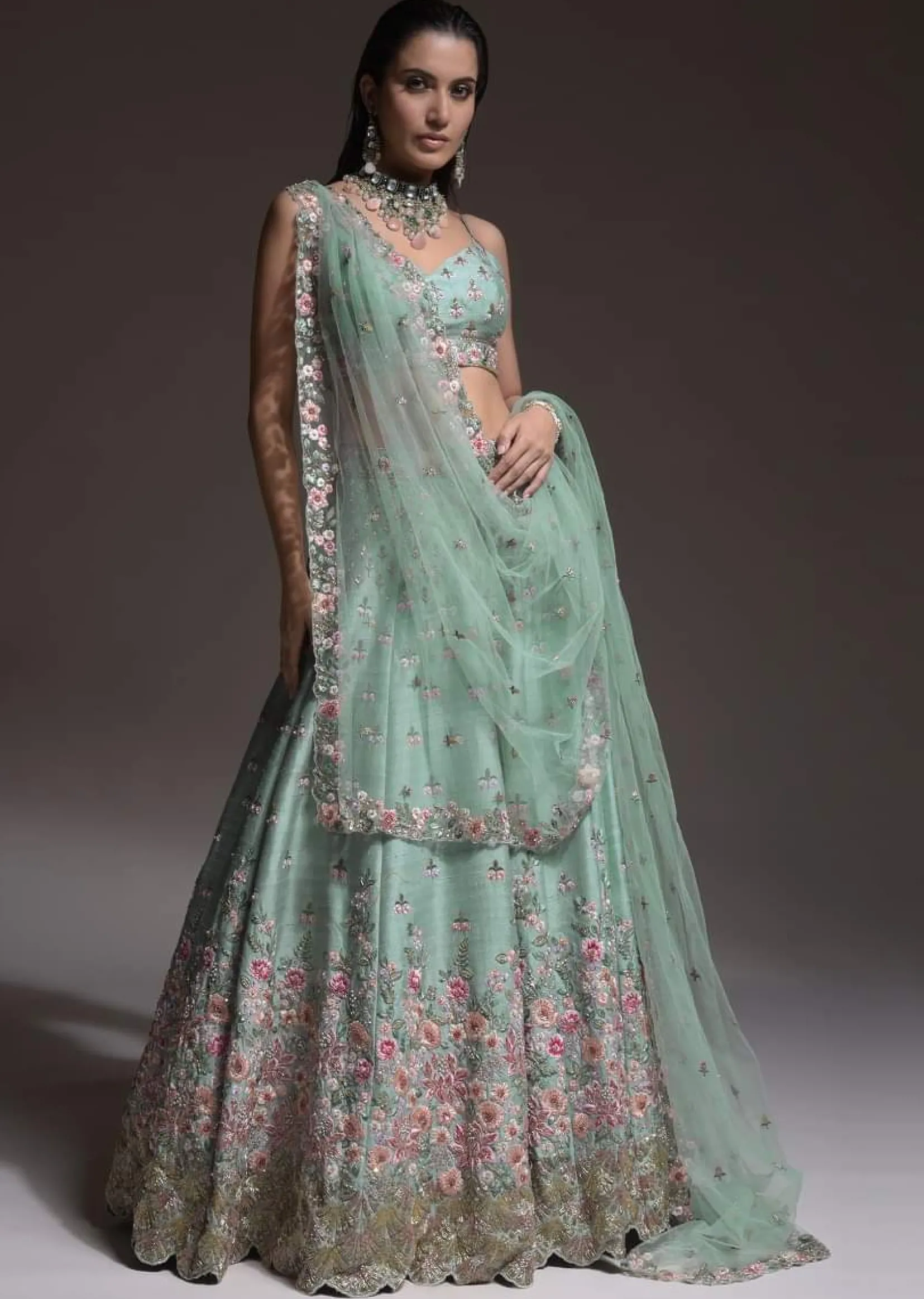 Sage Green Lehenga Choli In Raw Silk With Vibrant Resham Embroidered Cluster Of Summer Blooms And Buttis