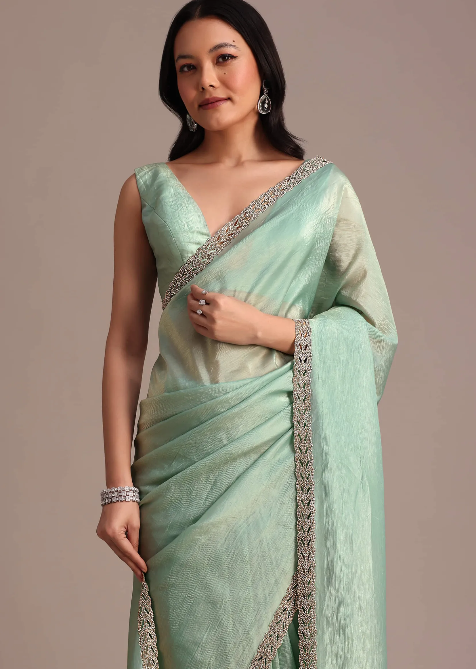 Sea Green Crushed Tissue Saree With Stone Embellished Border