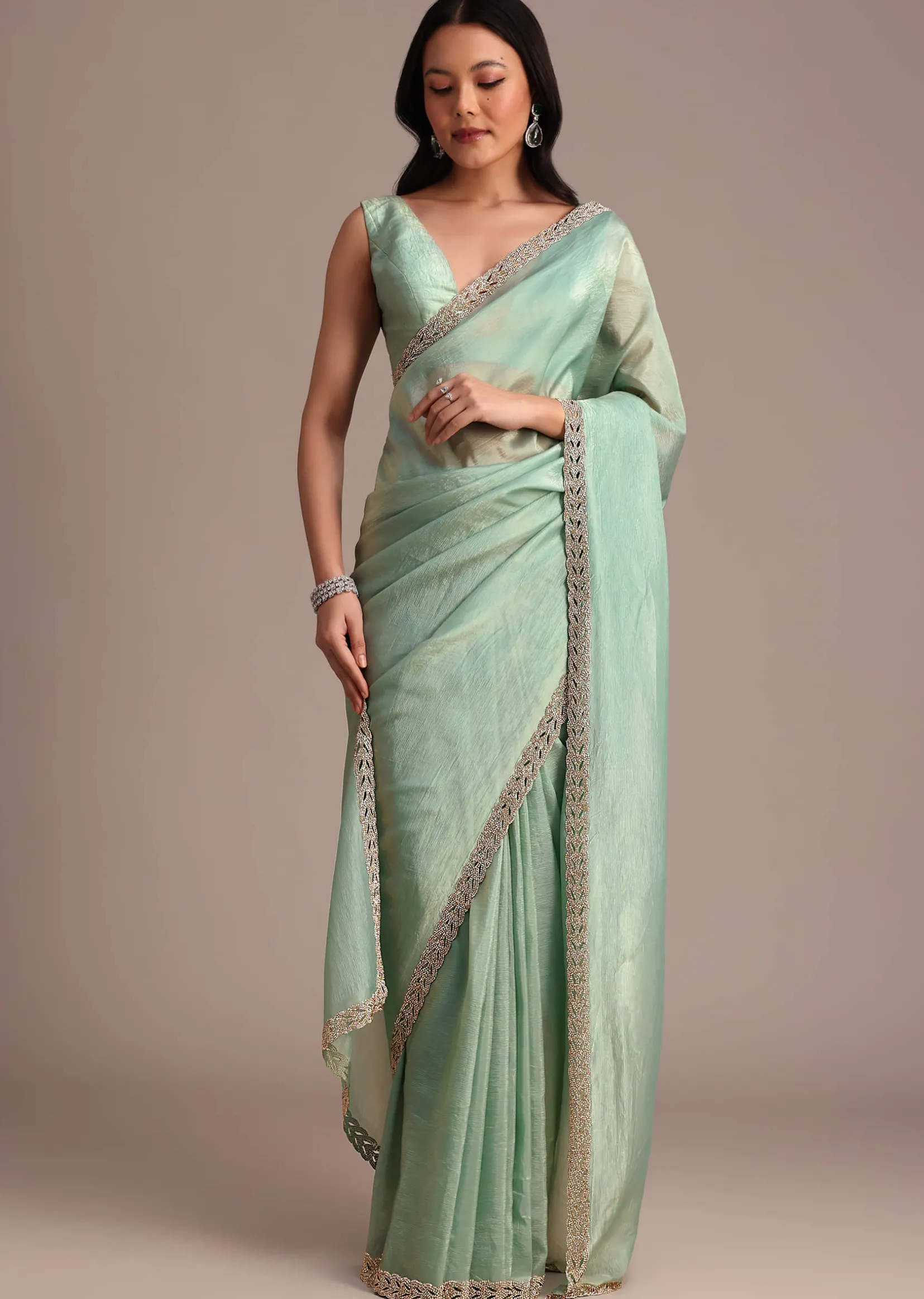 Sea Green Crushed Tissue Saree With Stone Embellished Border
