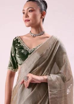 Silver Zari Tissue Saree With Embroidered Emerald Green Stitched Blouse
