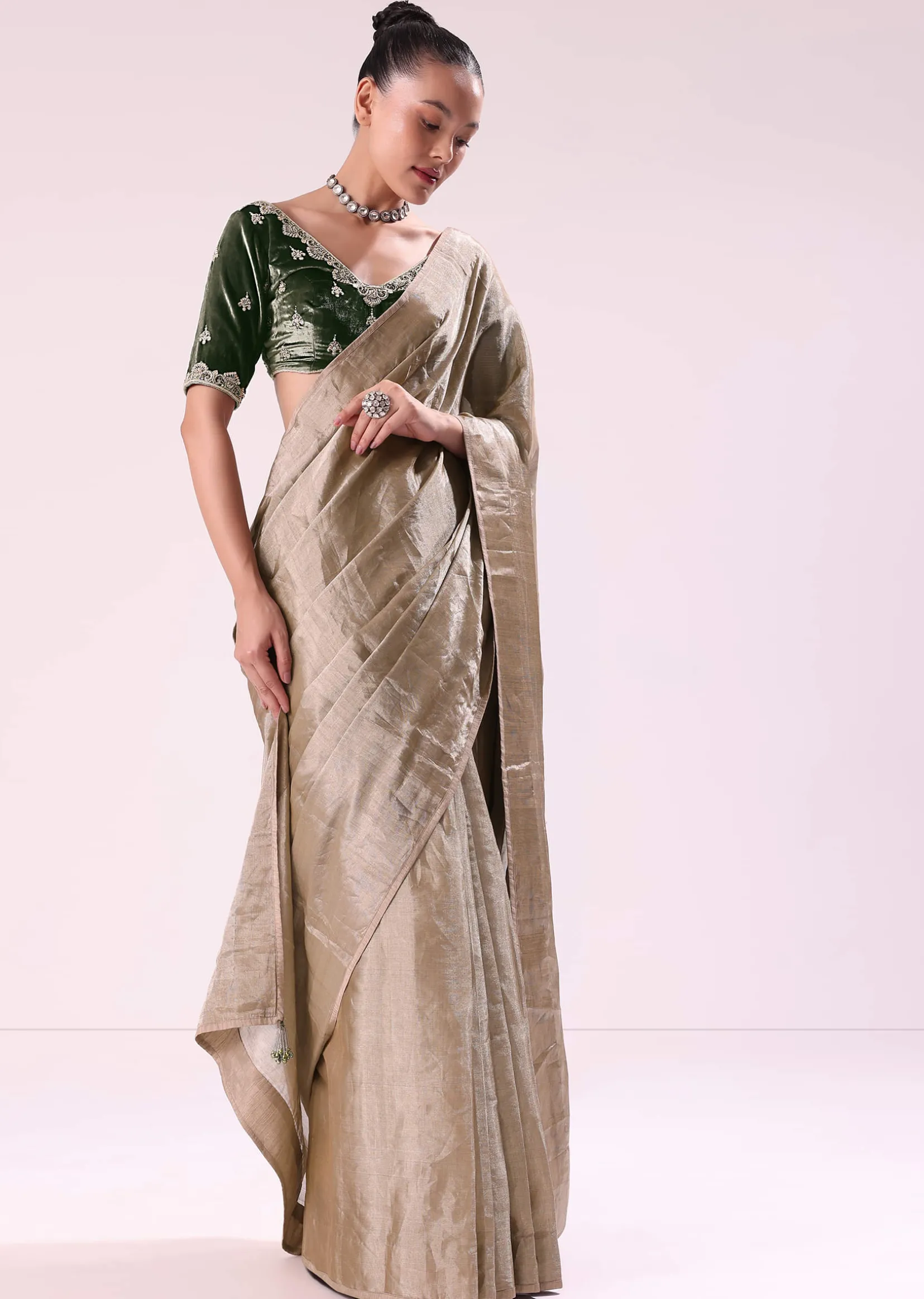 Silver Zari Tissue Saree With Embroidered Emerald Green Stitched Blouse