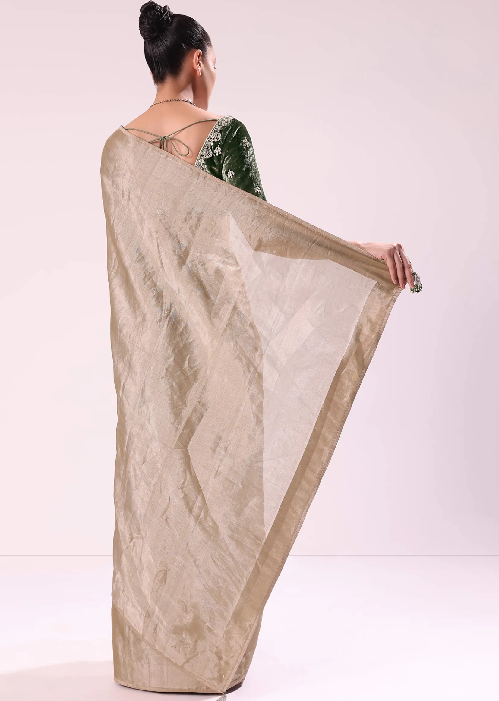 Silver Zari Tissue Saree With Embroidered Emerald Green Stitched Blouse