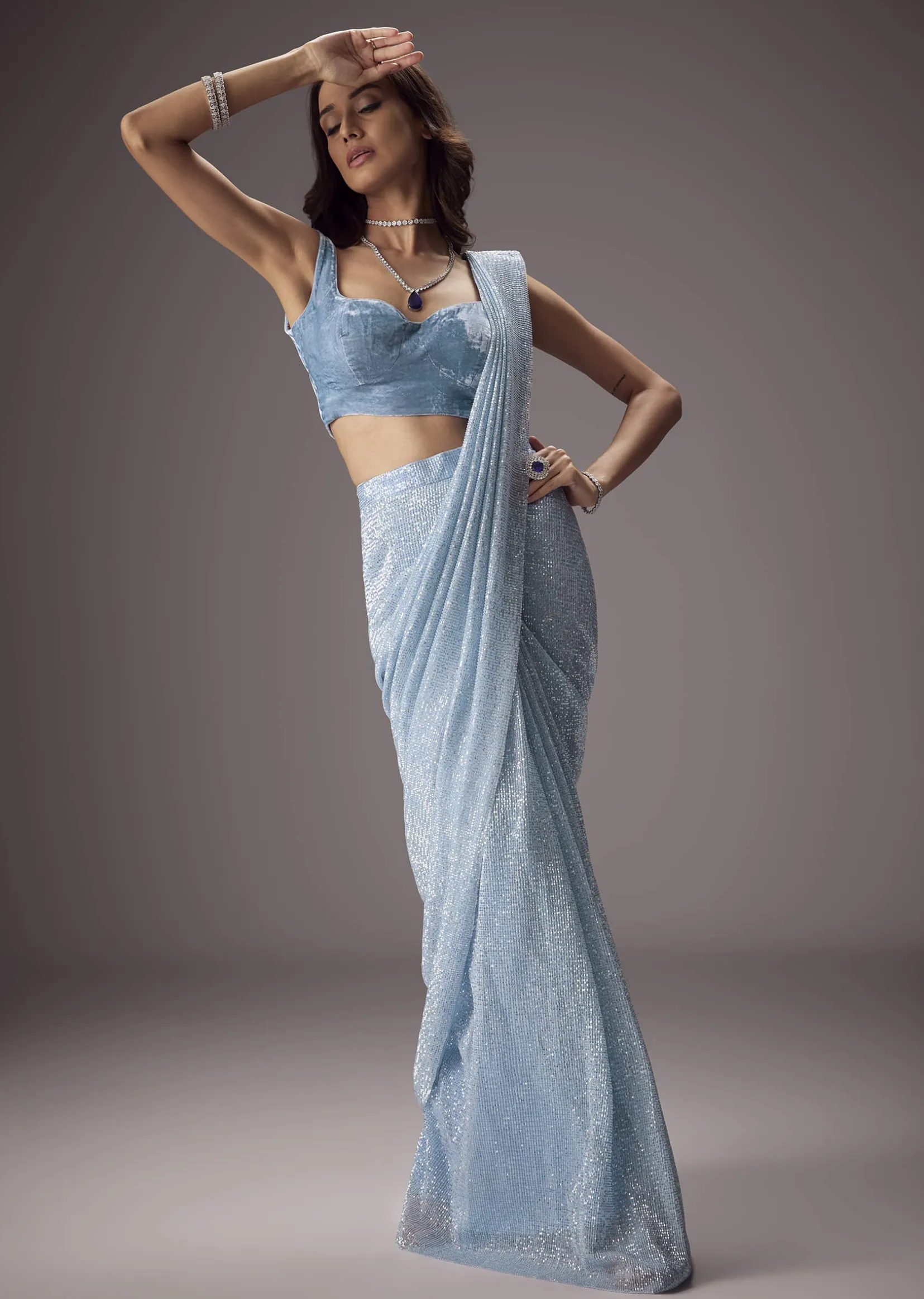 Sky Blue Shimmer Saree Paired With A Sweetheart Velvet Blouse