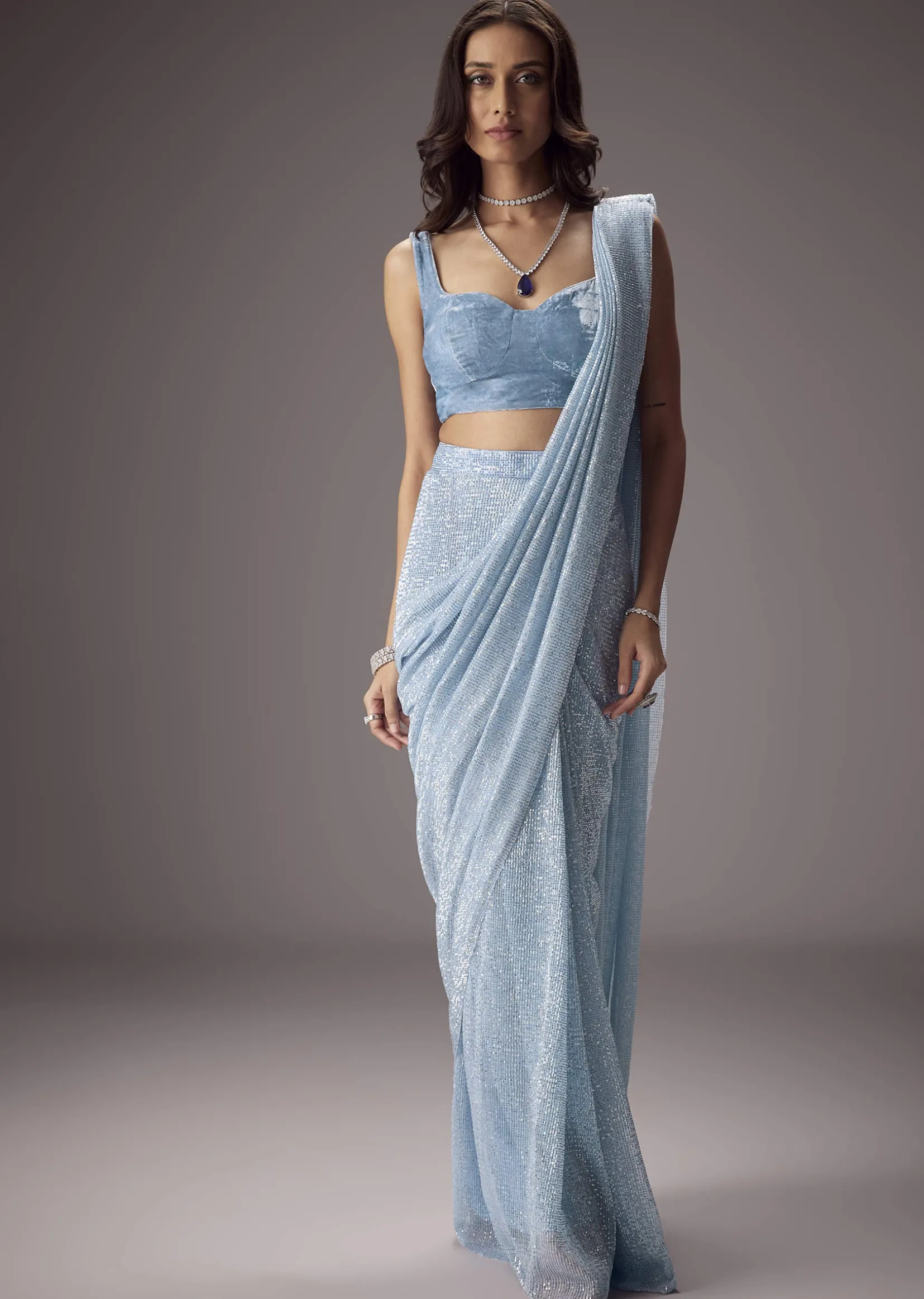 Sky Blue Shimmer Saree Paired With A Sweetheart Velvet Blouse