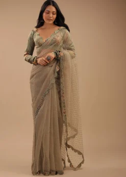 Tea Green Organza Saree With Self Buttis And A Floral Printed Satin Blouse