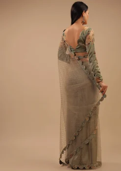Tea Green Organza Saree With Self Buttis And A Floral Printed Satin Blouse
