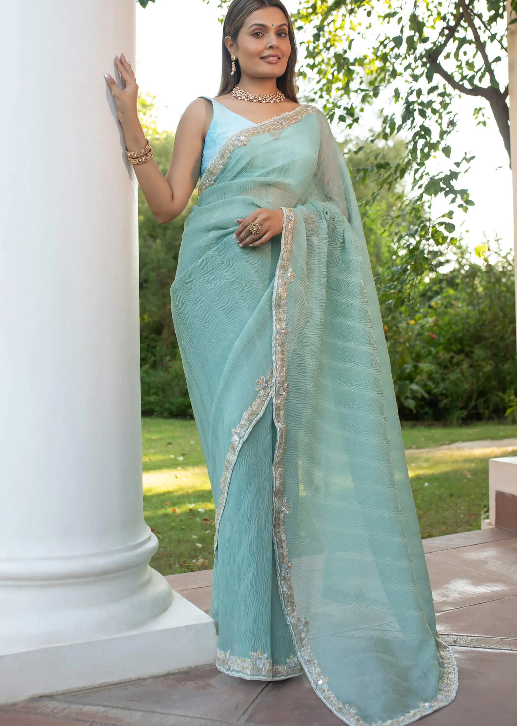 Turquoise Blue Crush Tissue Cutdana Work Saree With Embroidered Border