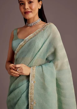 Turquoise Blue Crush Tissue Cutdana Work Saree With Embroidered Border