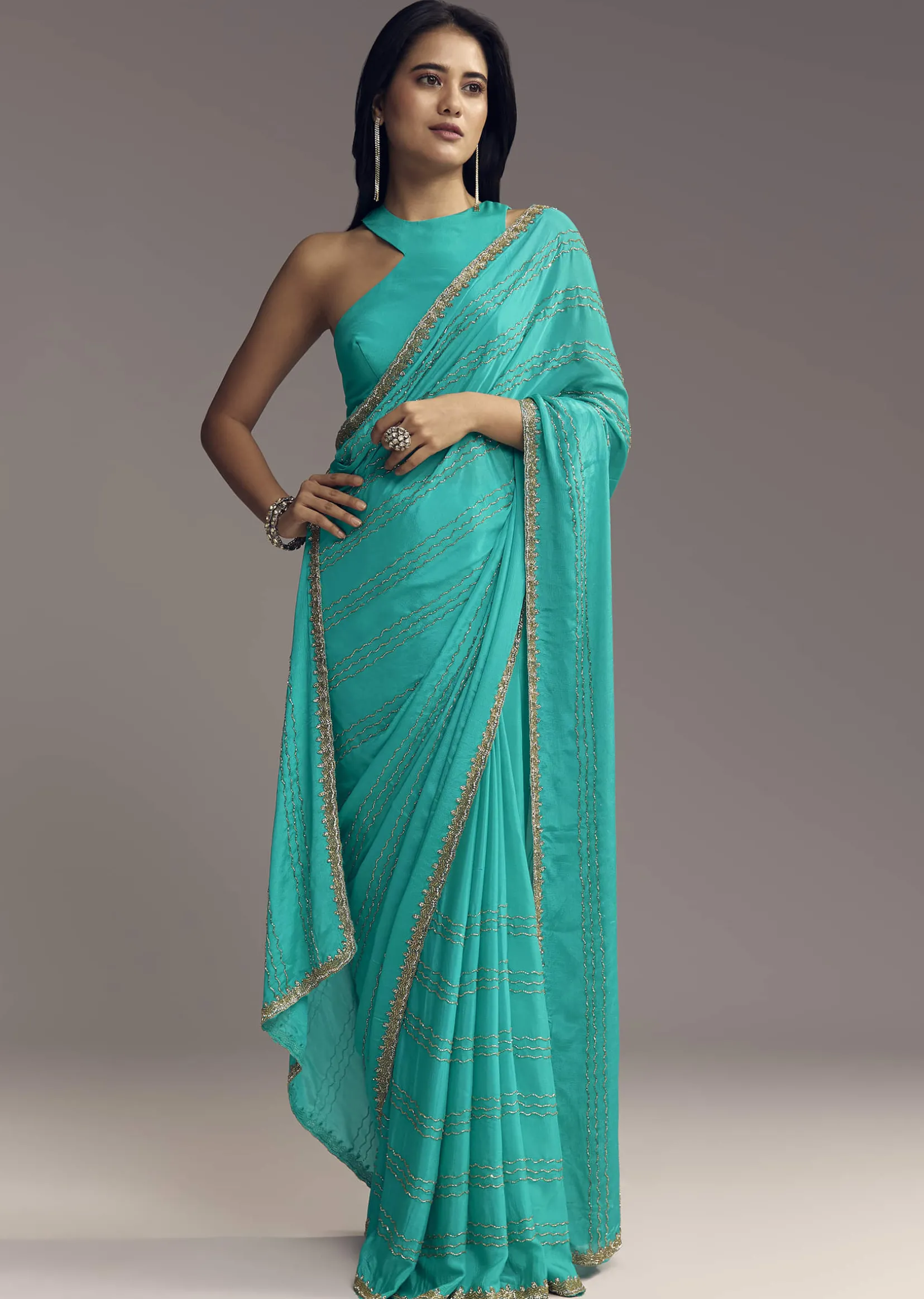 Turquoise Blue Embroidered Chinon Saree With Wavy Border