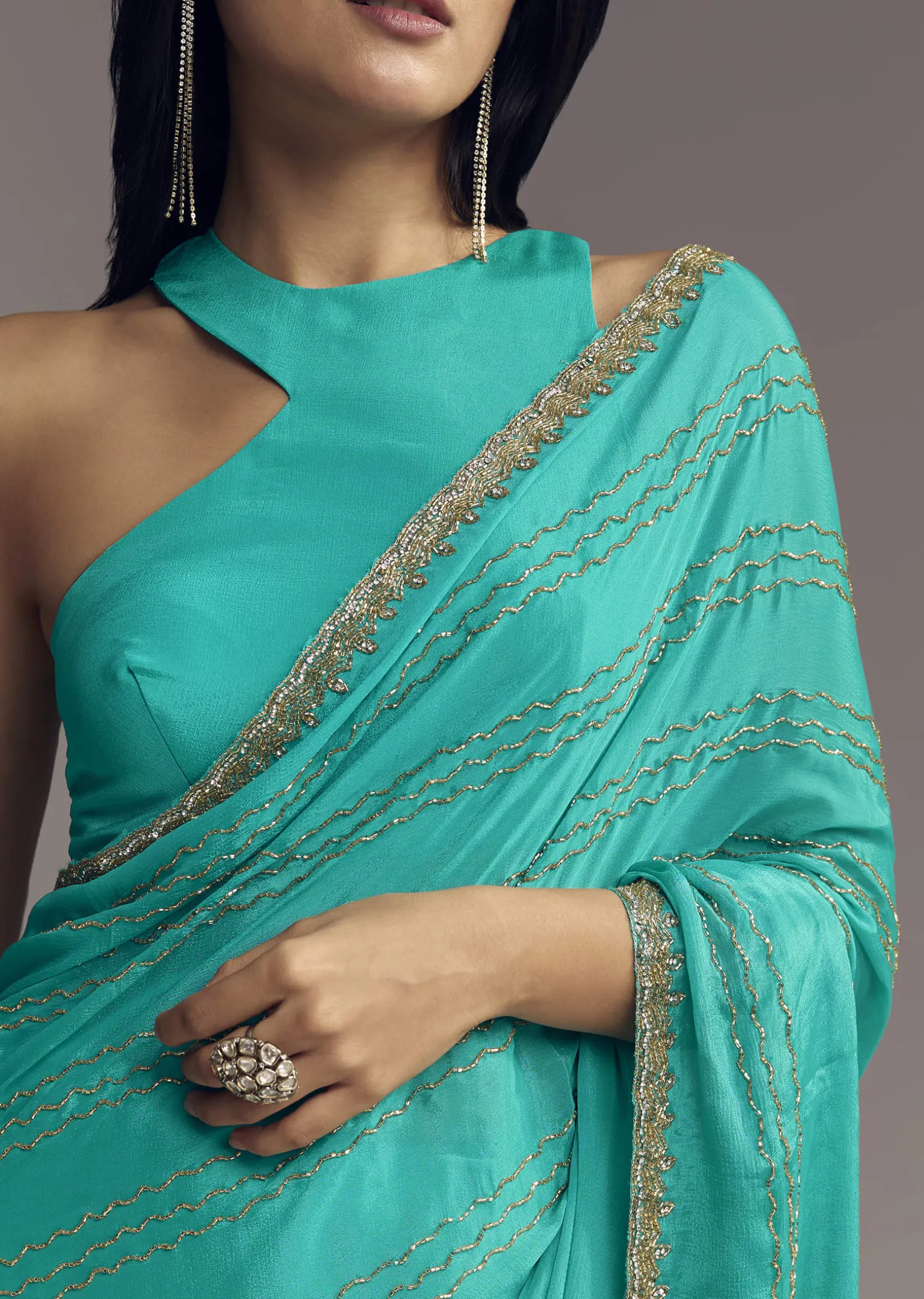 Turquoise Blue Embroidered Chinon Saree With Wavy Border