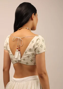 White Padded Blouse With Golden zardosi Border And Thread Work In Green
