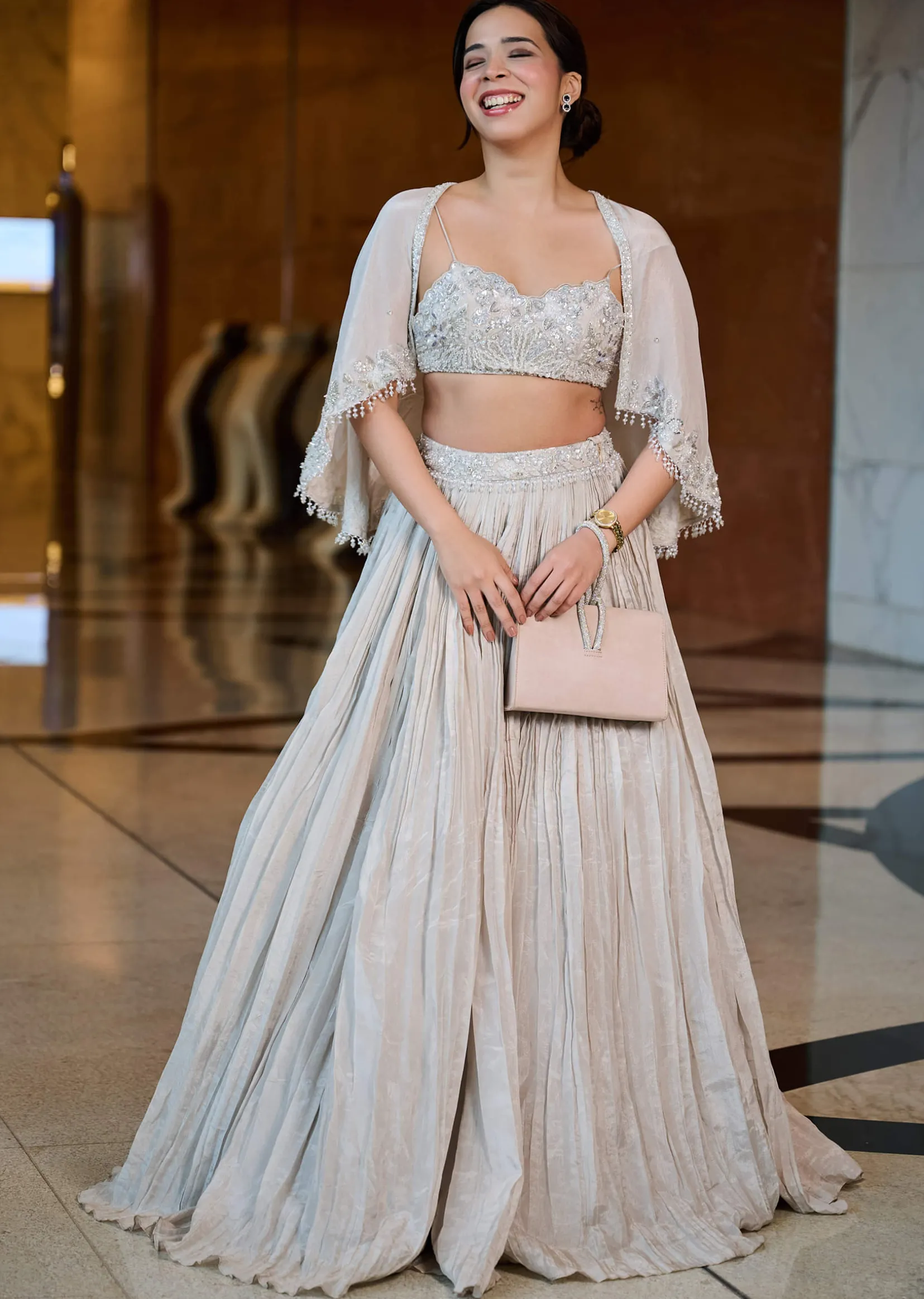 White Ruched Lehenga With Spaghetti Blouse And Cape