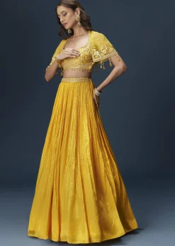 Yellow Bridesmaid Lehenga With Sleeveless Blouse And Draped Cape