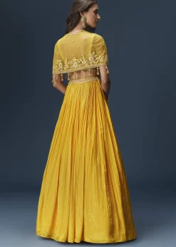 Yellow Bridesmaid Lehenga With Sleeveless Blouse And Draped Cape